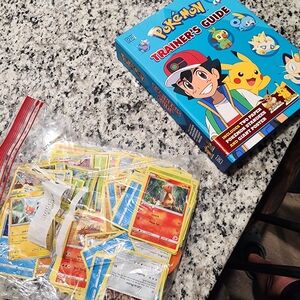 Pokemon Trainer's Guide with Various Trading Cards